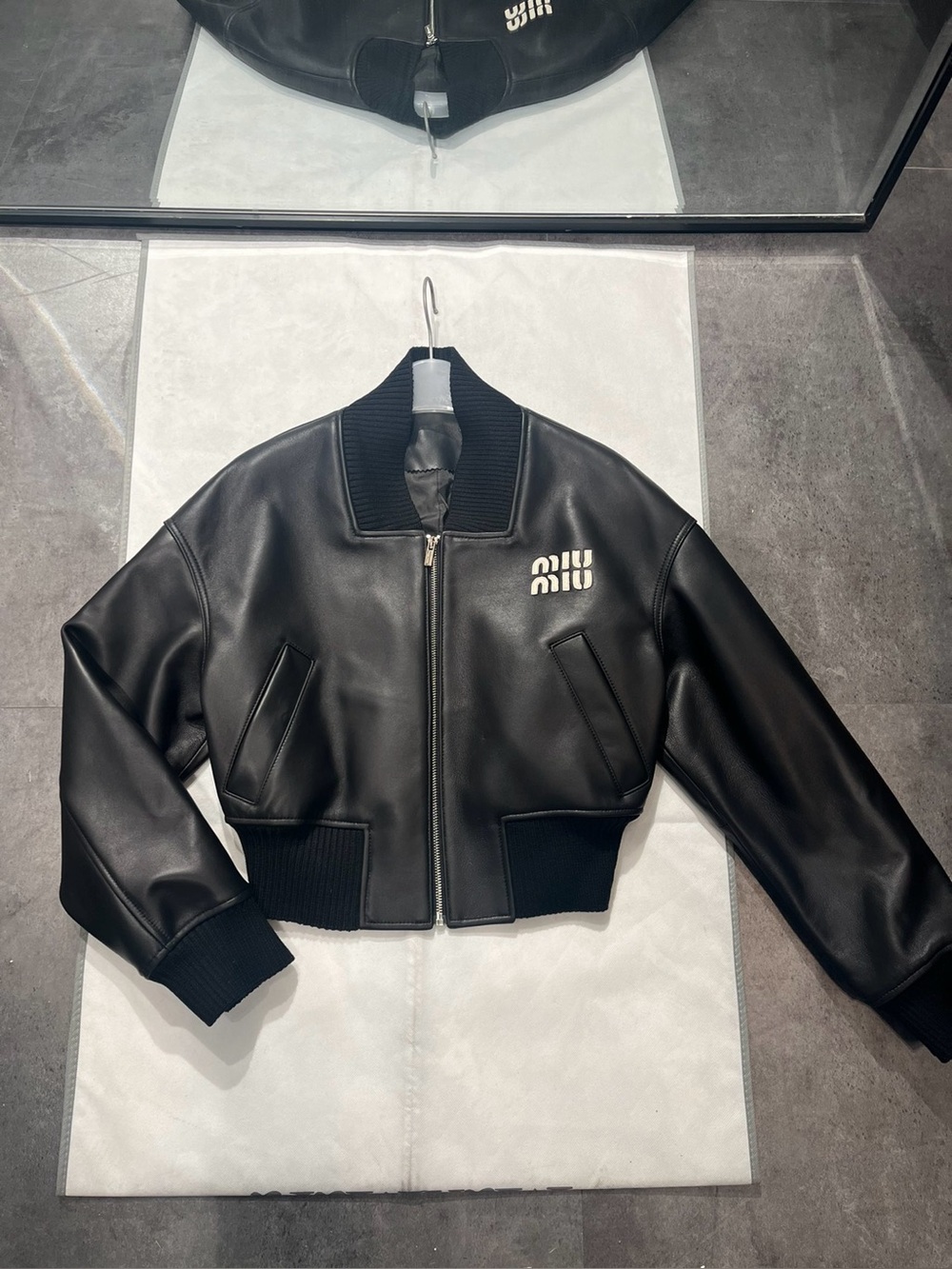 Miu Miu Black Cropped Leather Bomber with White Logo Detail